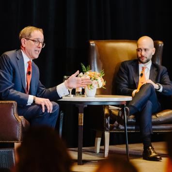 President Eisgruber seated on stage, in conversation with Gabe Debenedetti