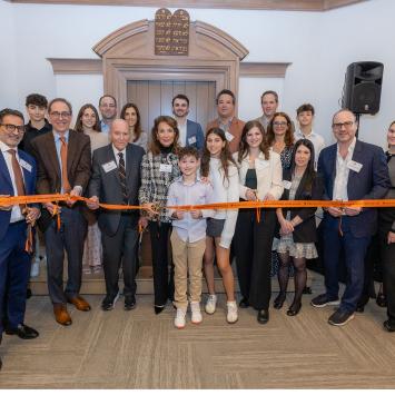 The Mandelbaum Family cuts the ribbon at the dedication of the dining pavilion