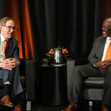 President Eisgruber on stage, seated opposite John Mack
