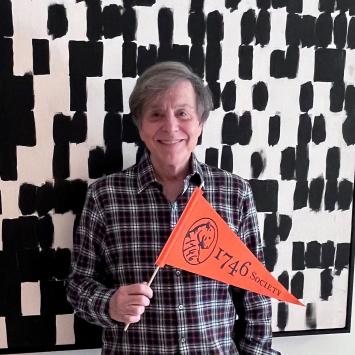 Headshot of Gary Forlini holding a 1746 Society pennant