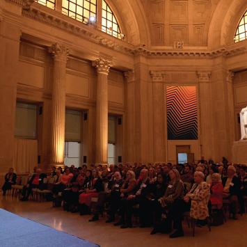 President Eisgruber sits on stage in front of an audience of Princeton alumni at the Franklin Institute in Phialdelphia. 