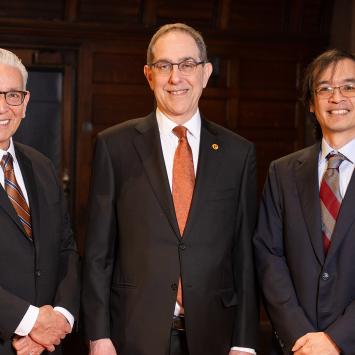 Kevin Gover, President Eisgruber and Terence Tao standing side by side on the stage of Richardson Auditorium.