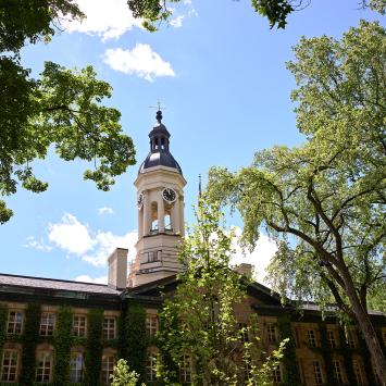 Nassau Hall, with the cuppola framed by blue sky