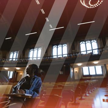 A lone student sitting in McCosh 50