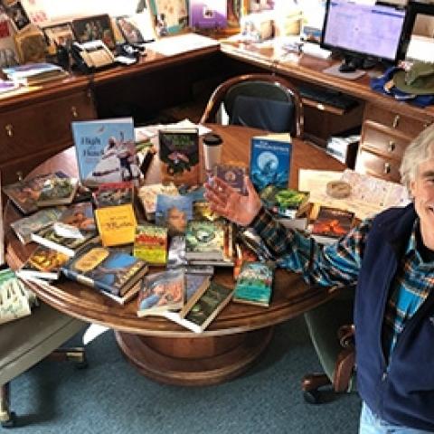 Tom Barron with his books