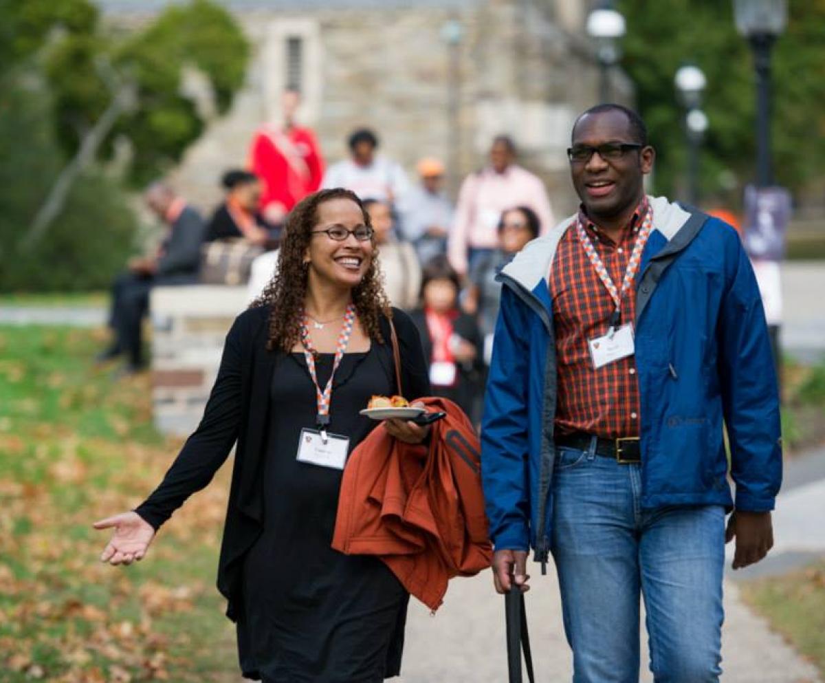 Alumni at Coming Back 2014 walking on campus. 