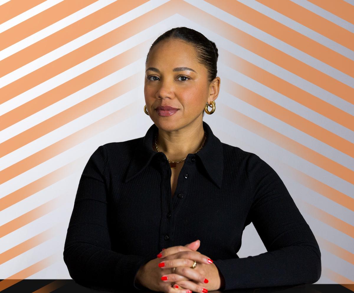 Autumn Woman, dressed in black, posing for camera