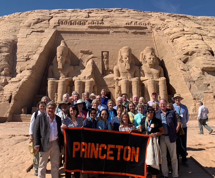Travelers with Princeton banner in the Egyptian desert. 