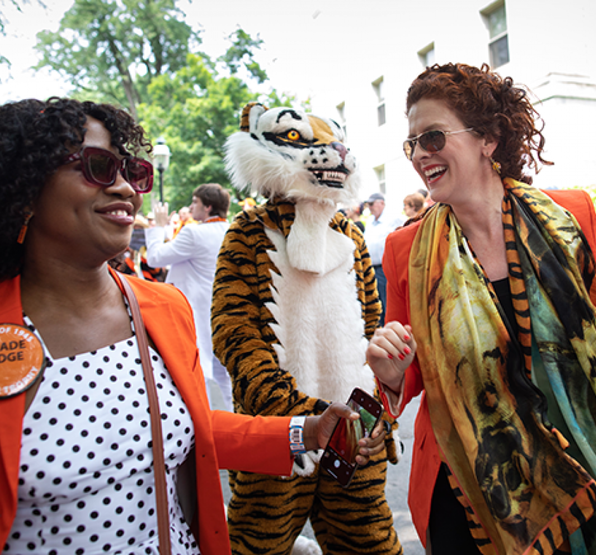 Alumni greet each other at the P-Rade