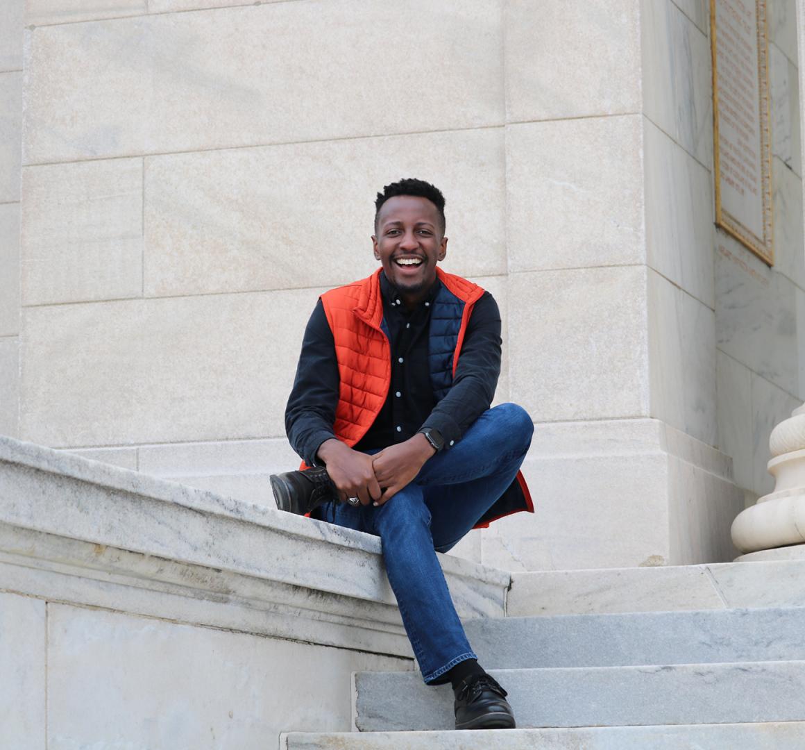 Brandon McGhee sitting on campus.