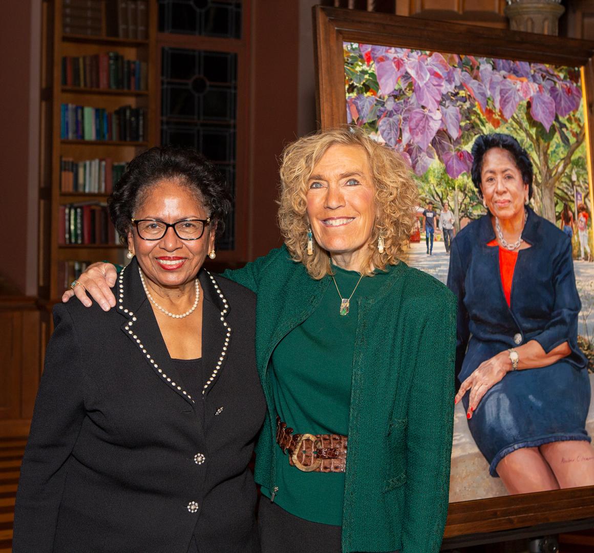 Ruth Simmons and Elaine Fuchs posing in front of Simmons' portrait