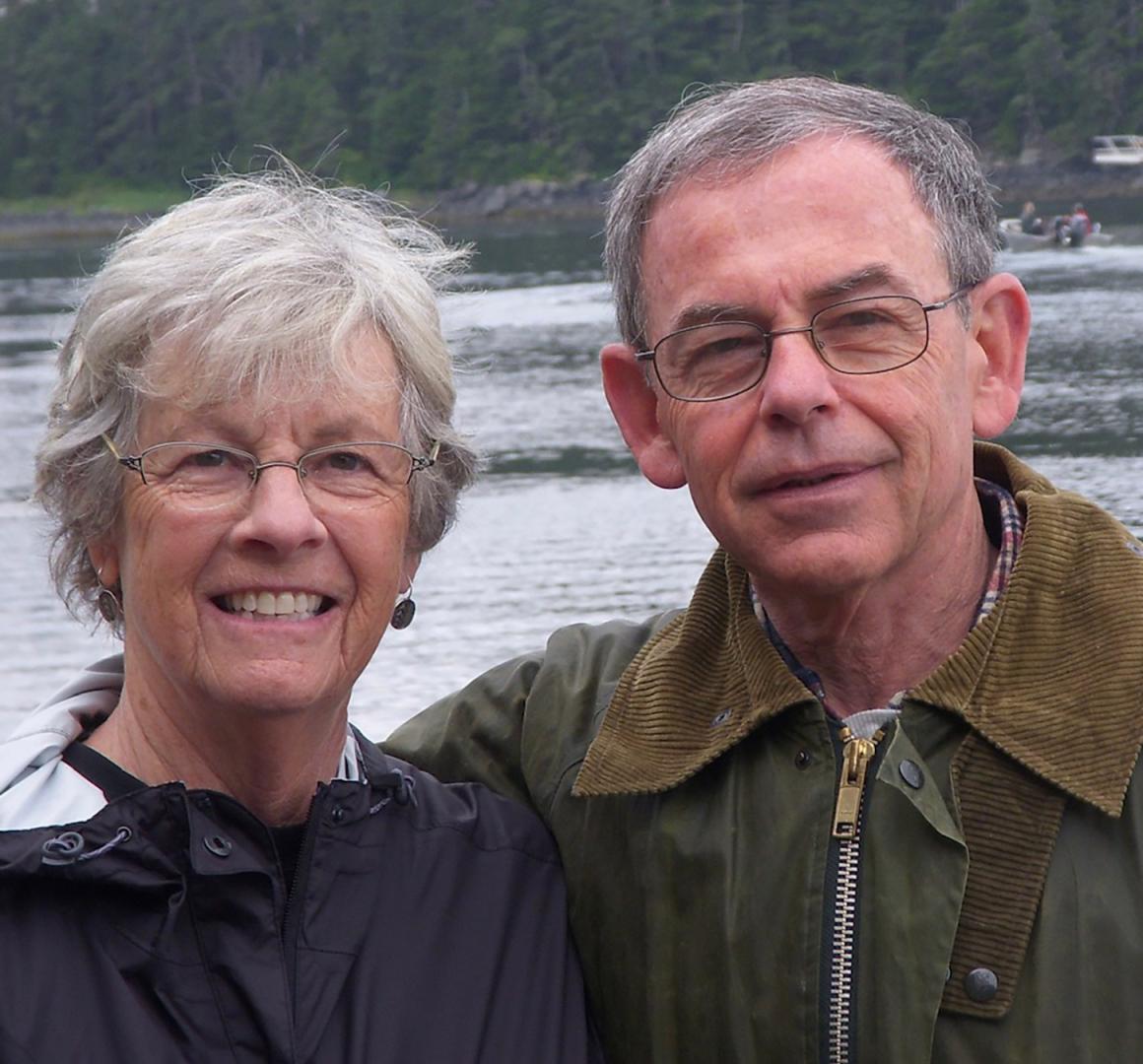 Myles Cohen with his wife, pictured in front of a river.