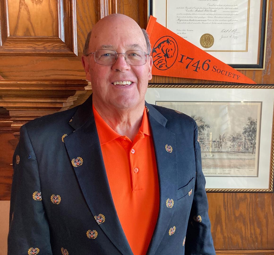 Curt FitzGerald in front of a 1746 Society flag