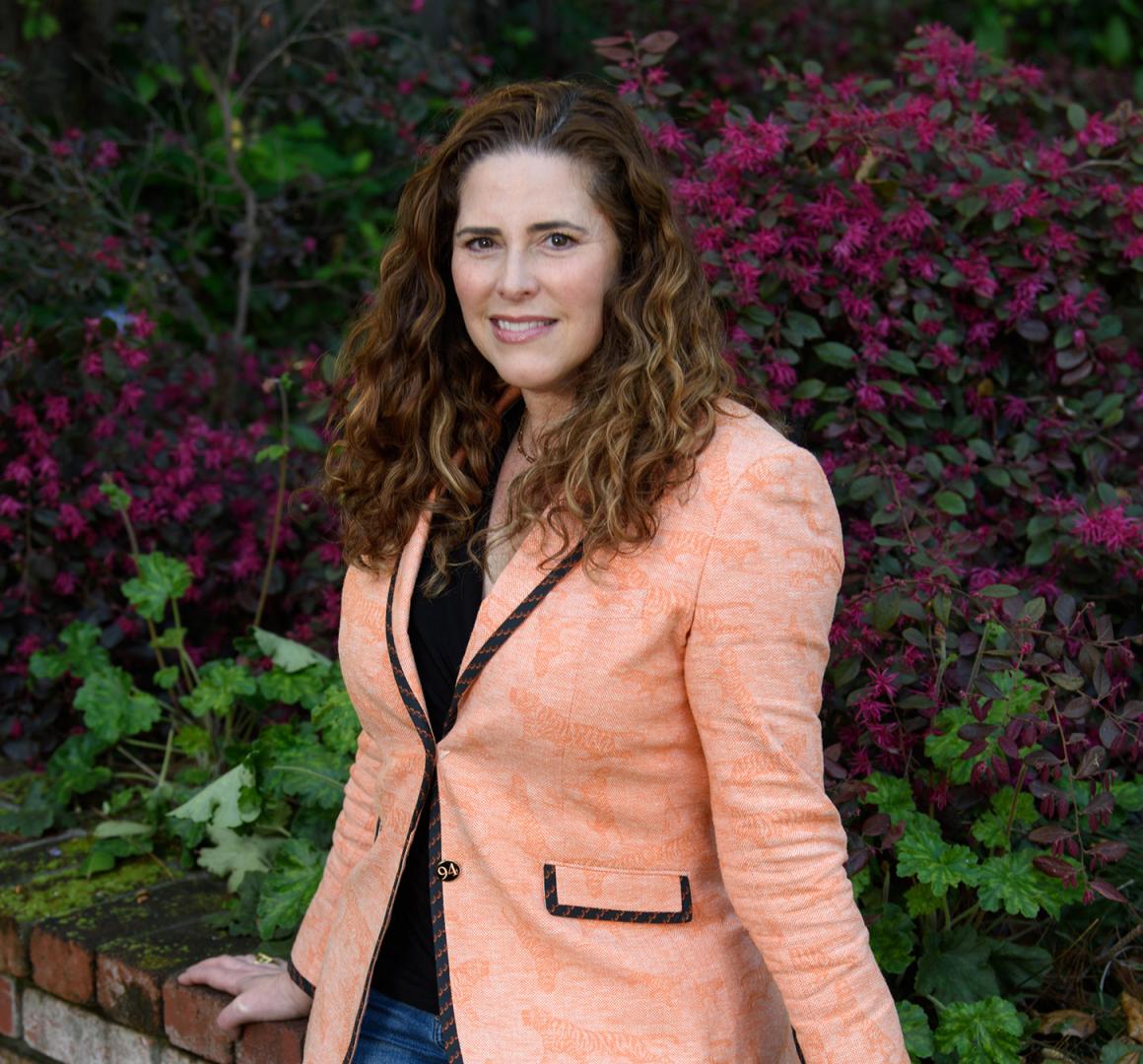 Melissa Zdrodoski wearing an orange Princeton blazer
