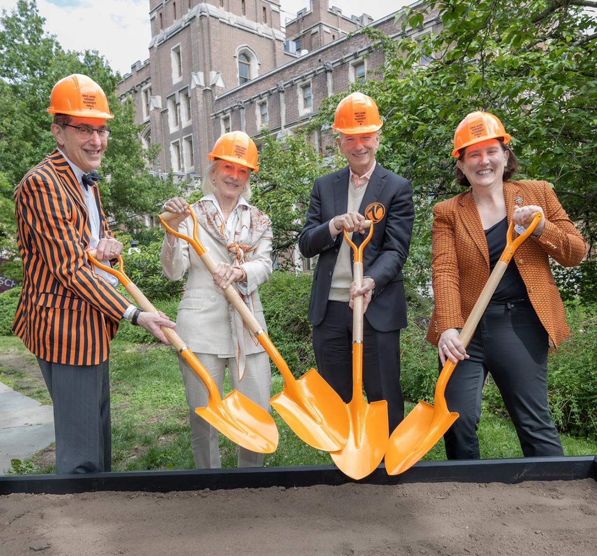 President Eisgruber, Wendy and Eric Schmidt, and Jen Rexford don orange hard hats and grab orange shovels for a ceremonial groundbreaking