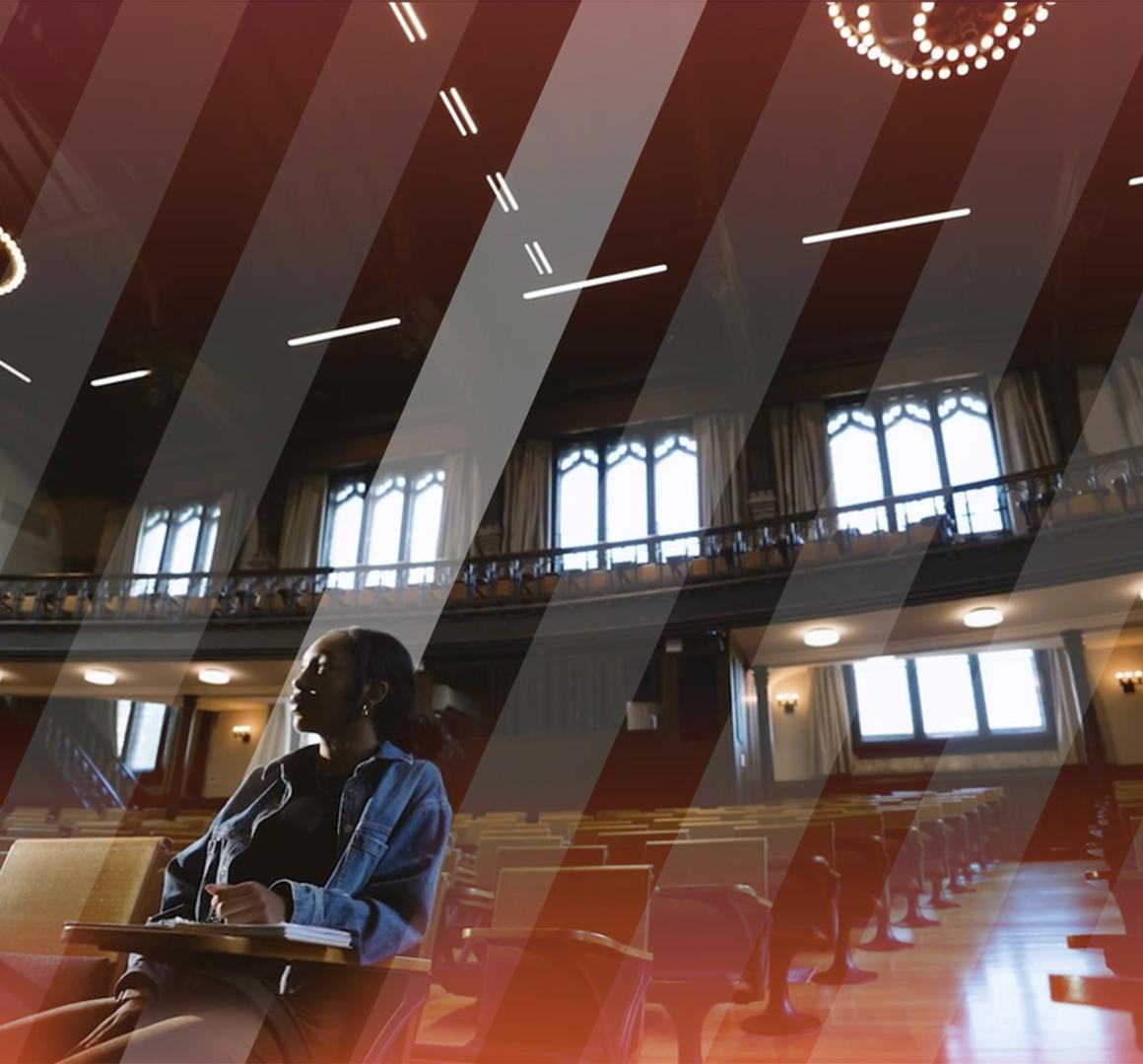 A lone student sitting in McCosh 50