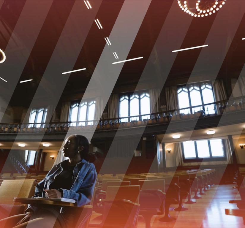 A lone student sitting in McCosh 50