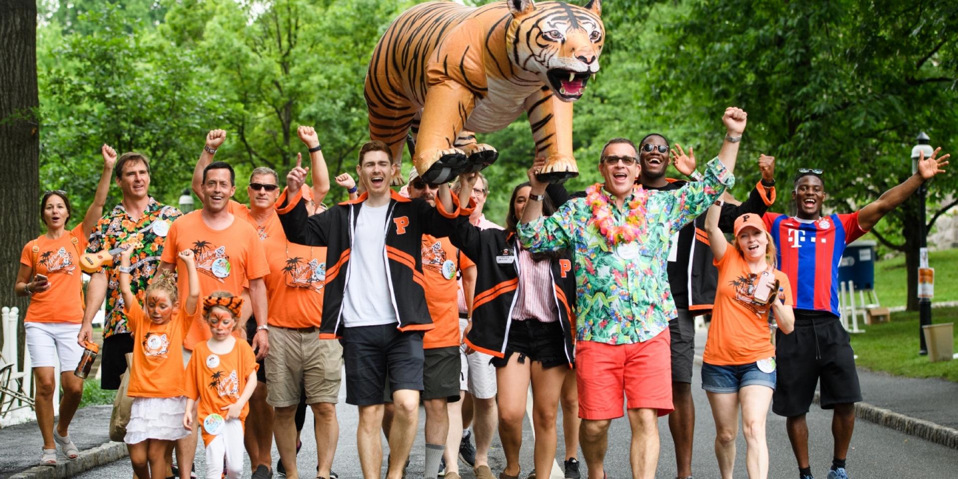 Group photo of alumni and children on P-rade route.