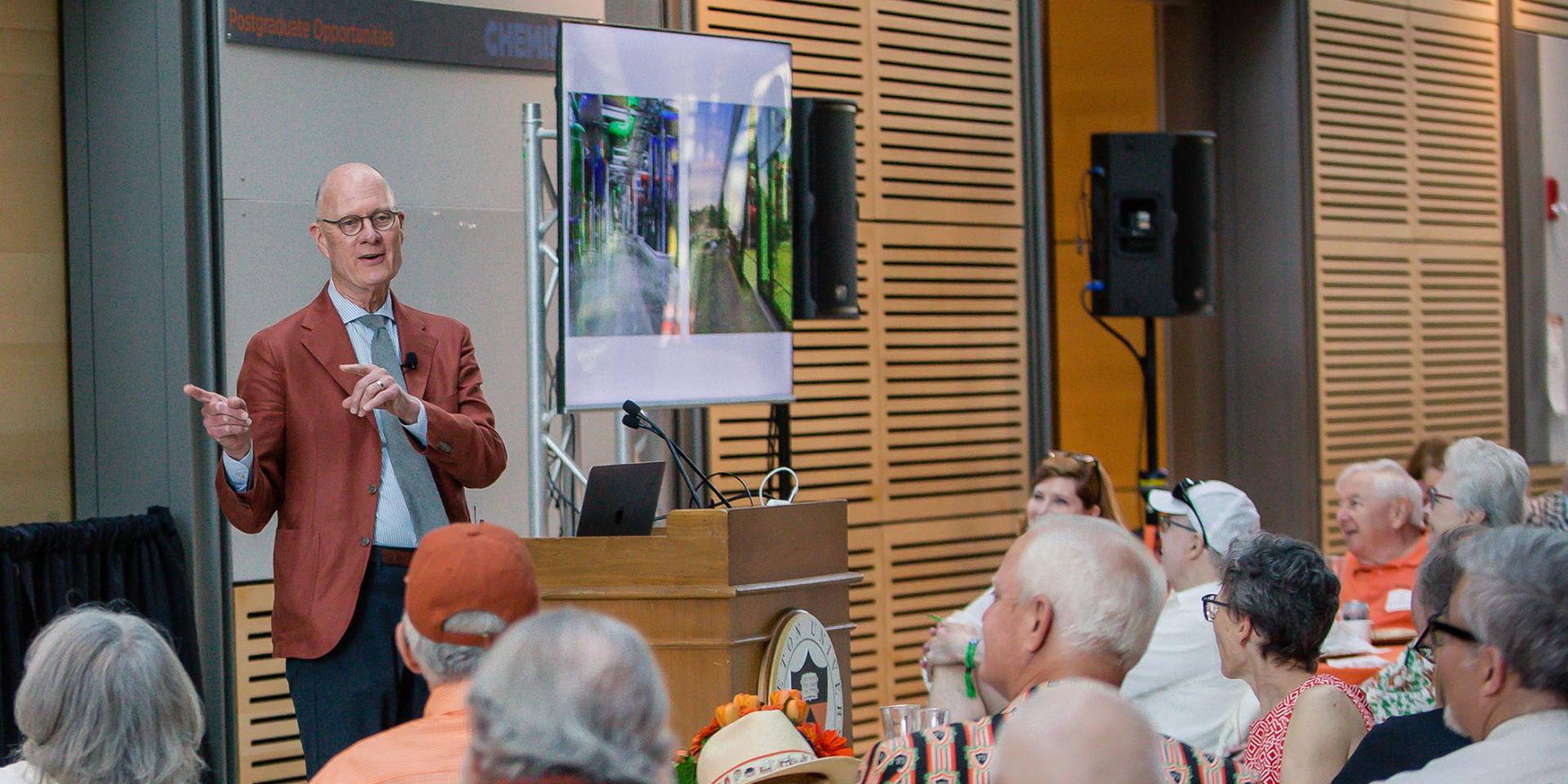University Architect Ronald J. McCoy *80 at a podium 