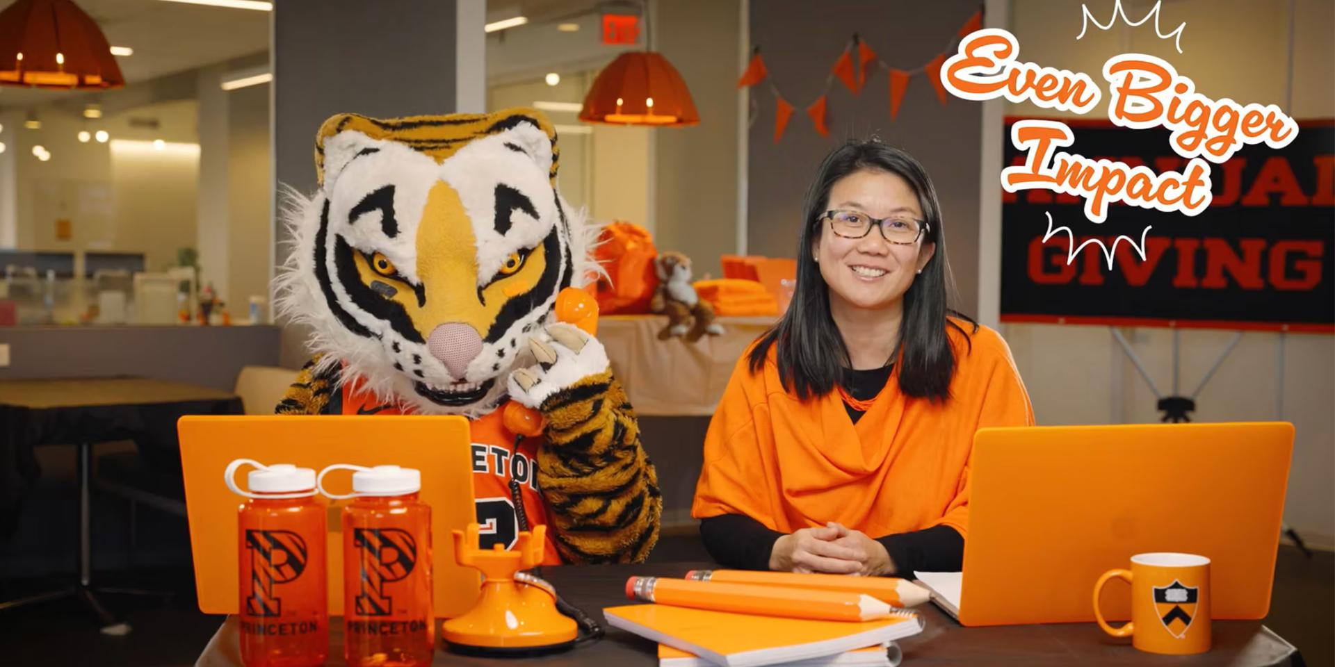 Deb Yu and Tiger working on their laptop computers. 