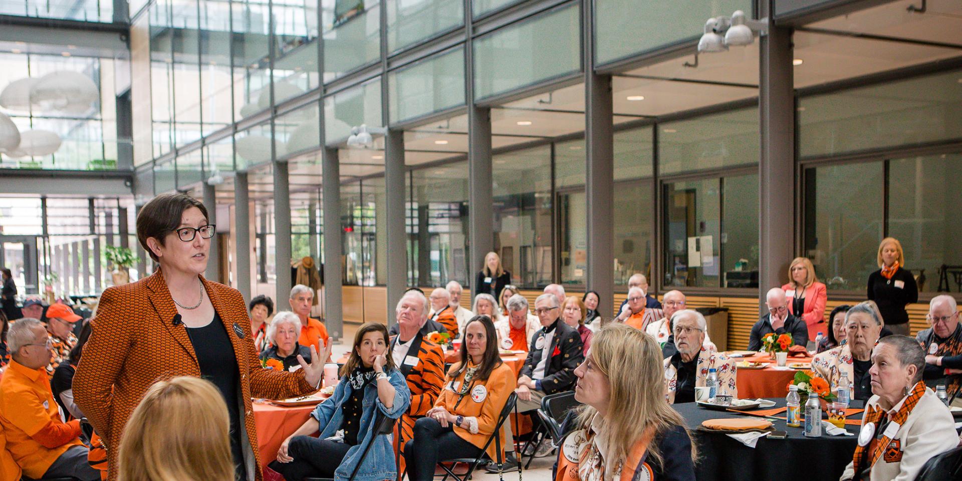 Jennifer Rexford speaks to alumni seated at tables