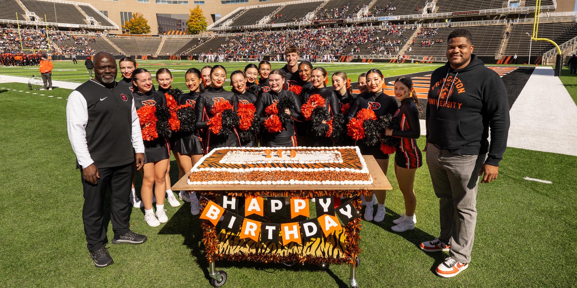 on field cake celebration at homecoming 2025