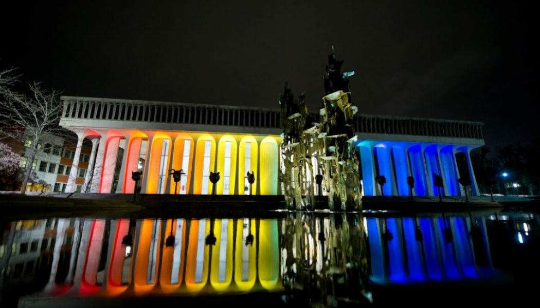 Building lit up in rainbow colors
