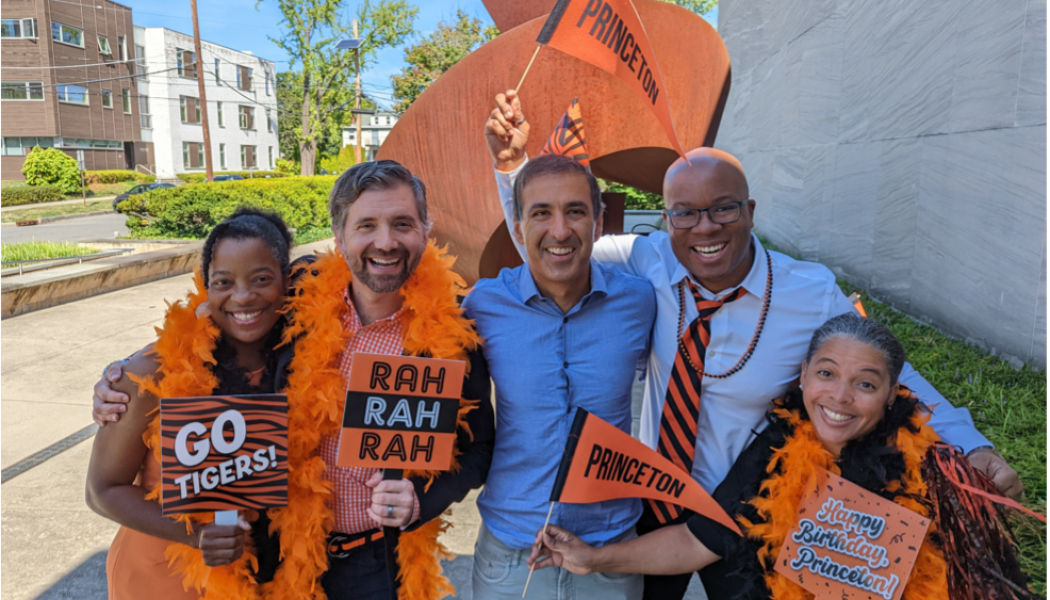alumni dressed in orange and black