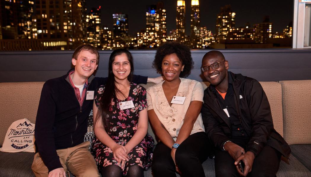 Alumni seated together at the Recent Alumni gathering in New York City