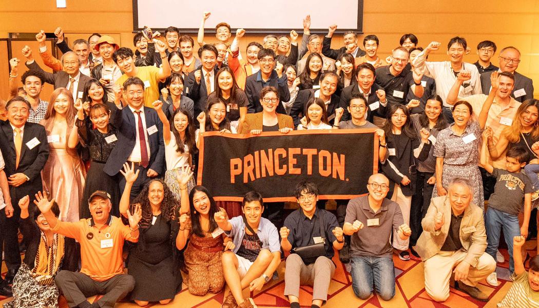 Jen Rexford and alumni from Japan hold a Princeton banner