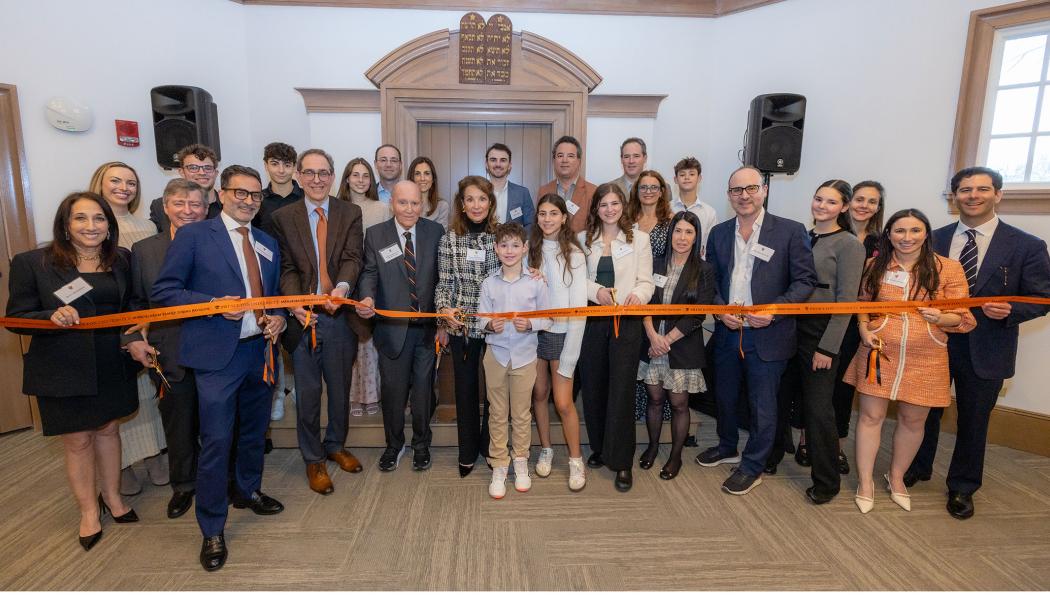 The Mandelbaum Family cuts the ribbon at the dedication of the dining pavilion