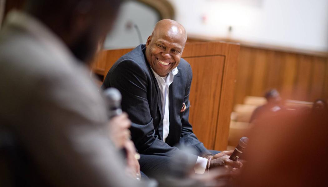  Craig Robinson, Class of 1983, is shown moderating a conversation during the alumni “Thrive” conference. 