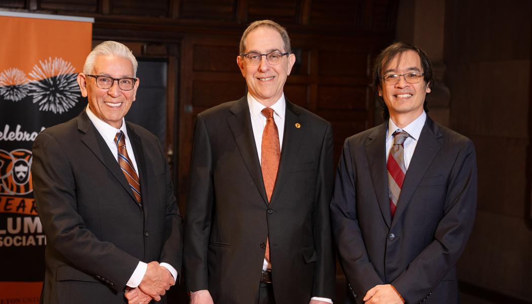 Kevin Gover, President Eisgruber and Terence Tao standing side by side on the stage of Richardson Auditorium.