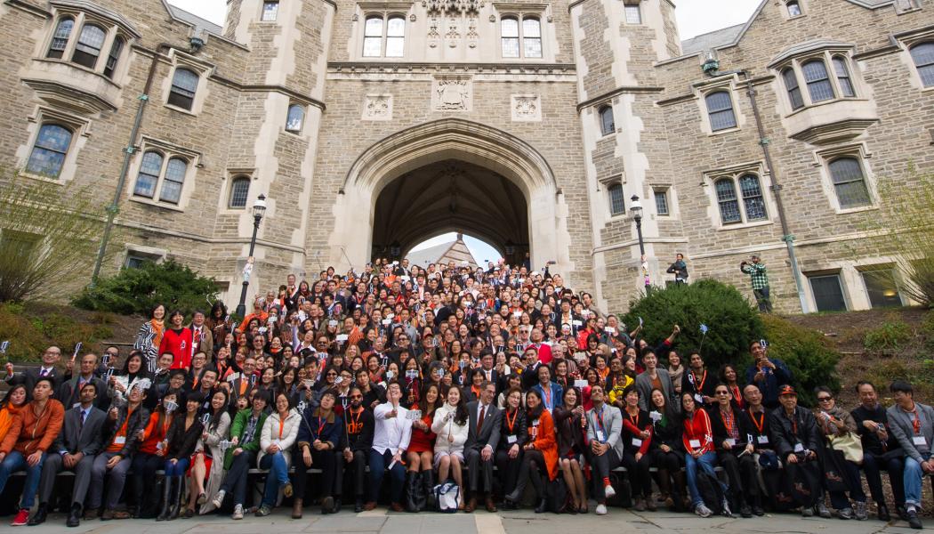 A group photo from the 2015 We Flourish conference with hundreds of Asian alumni on the steps of Blair Arch.