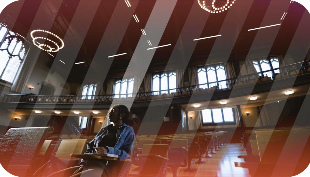 A lone student sitting in McCosh 50