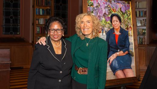 Ruth Simmons and Elaine Fuchs posing in front of Simmons' portrait