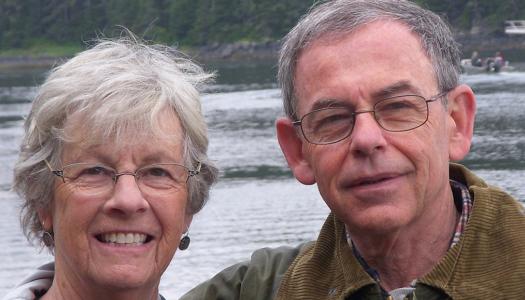 Myles Cohen and his wife, pictured outdoors near a river
