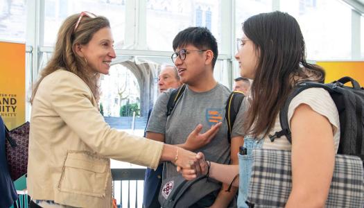 Emma Bloomberg greeting students at the dedication of the Bloomberg Center.
