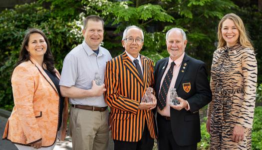 Alumni volunteer leaders pose with this year's Service Award winners