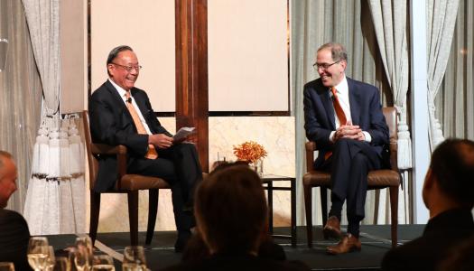 President Eisgruber and Harold Kim conversing on stage in Hong Kong
