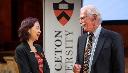 Fei-Fei Li and Johns Fitzpatrick conversing on the stage of Richardson Auditorium