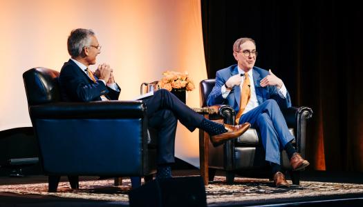 Philip Hammarskjold ’87 and President Christopher L. Eisgruber ’83 on stage together in West Palm Beach, Florida.