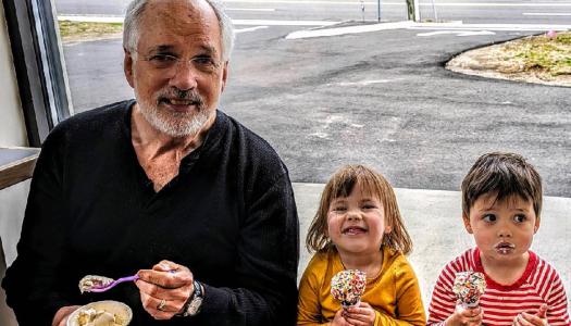 Doug Grover '74 and two grandchildren eat ice cream together