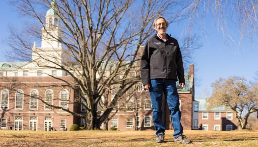 Avi Wigderson, standing near the Institute of Advanced Study