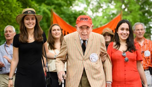 Joe Schein and his granddaughters walk in the 2018 P-rade