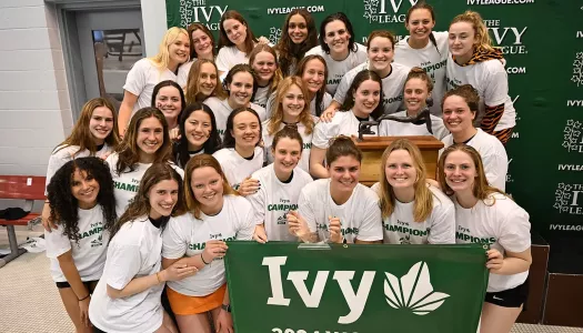 Members of the Princeton women's swimming and diving team celebrate their Ivy League title in 2024