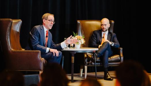 President Eisgruber seated on stage, in conversation with Gabe Debenedetti