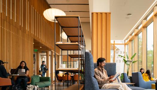 Students read quietly in one of the common spaces of Huo College