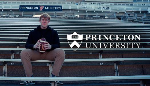 Justice Musser sits in the football stadium bleachers, cradling a football