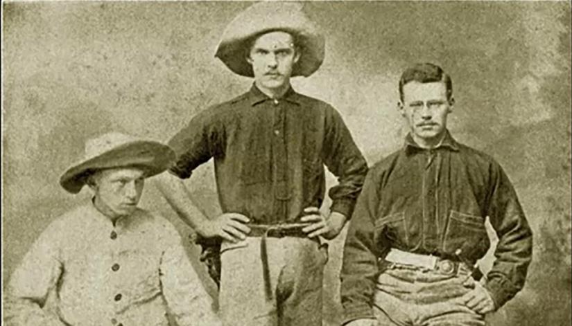 Sepia-toned portrait of three rugged looking men